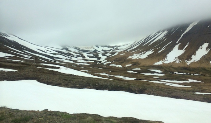 Snowy and foggy mountains in the Westfjords of iceland